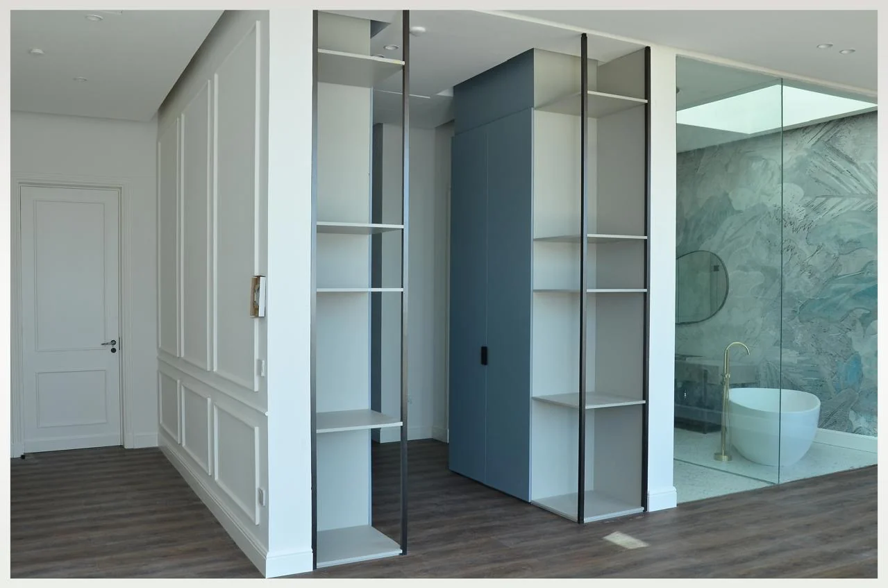 Fitted wardrobe with pale panels and open storage built by Time Furniture