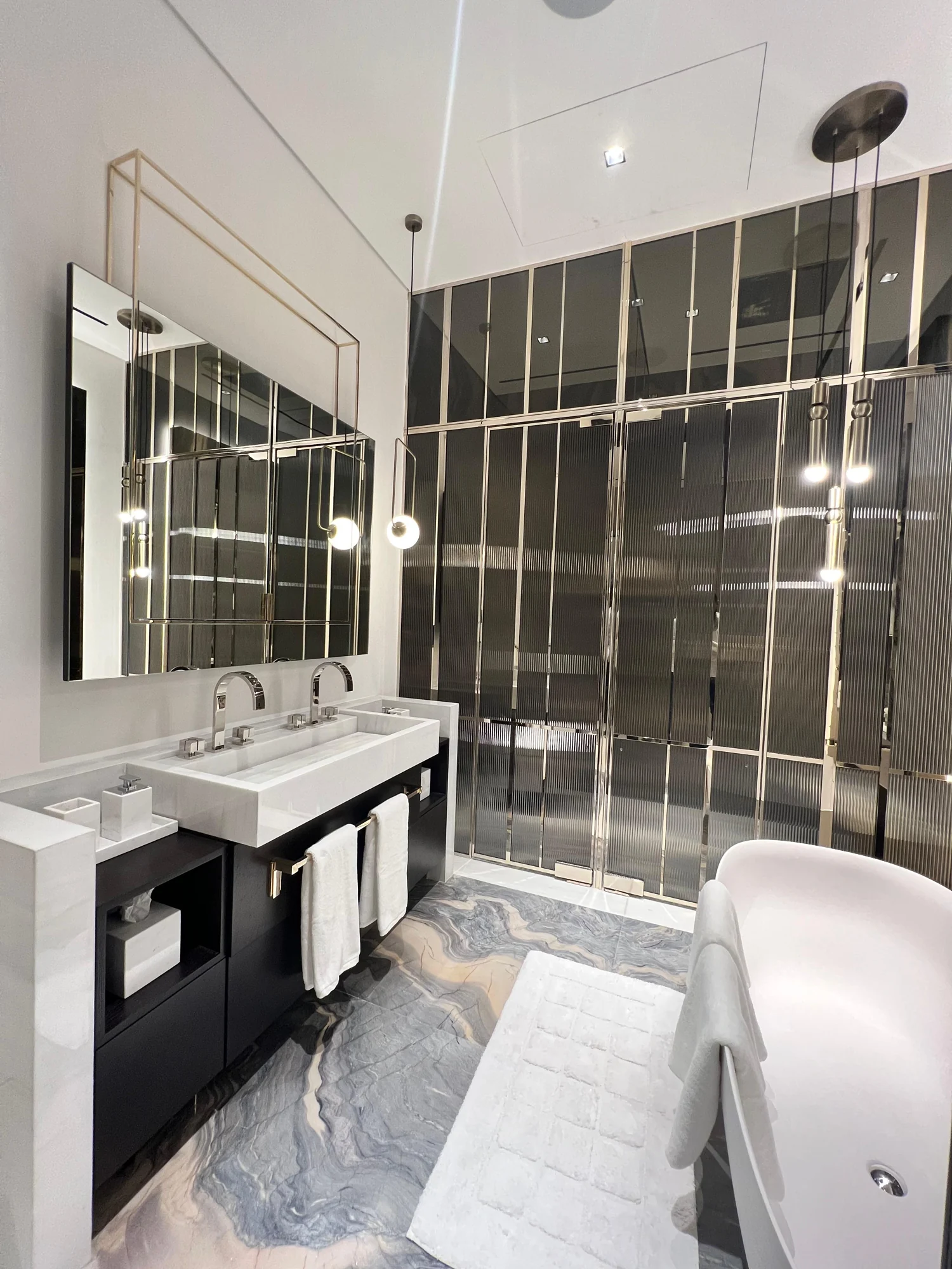 Marble bathroom with freestanding bath in a Jumeirah Islands villa by Time Furniture