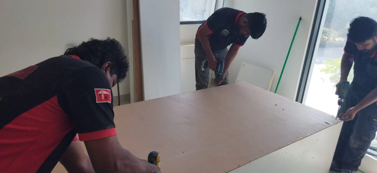 Time Furniture installation team assembling joinery