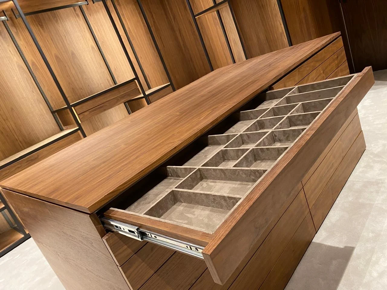 Open timber wardrobe drawer with small compartments for jewellery and accessories