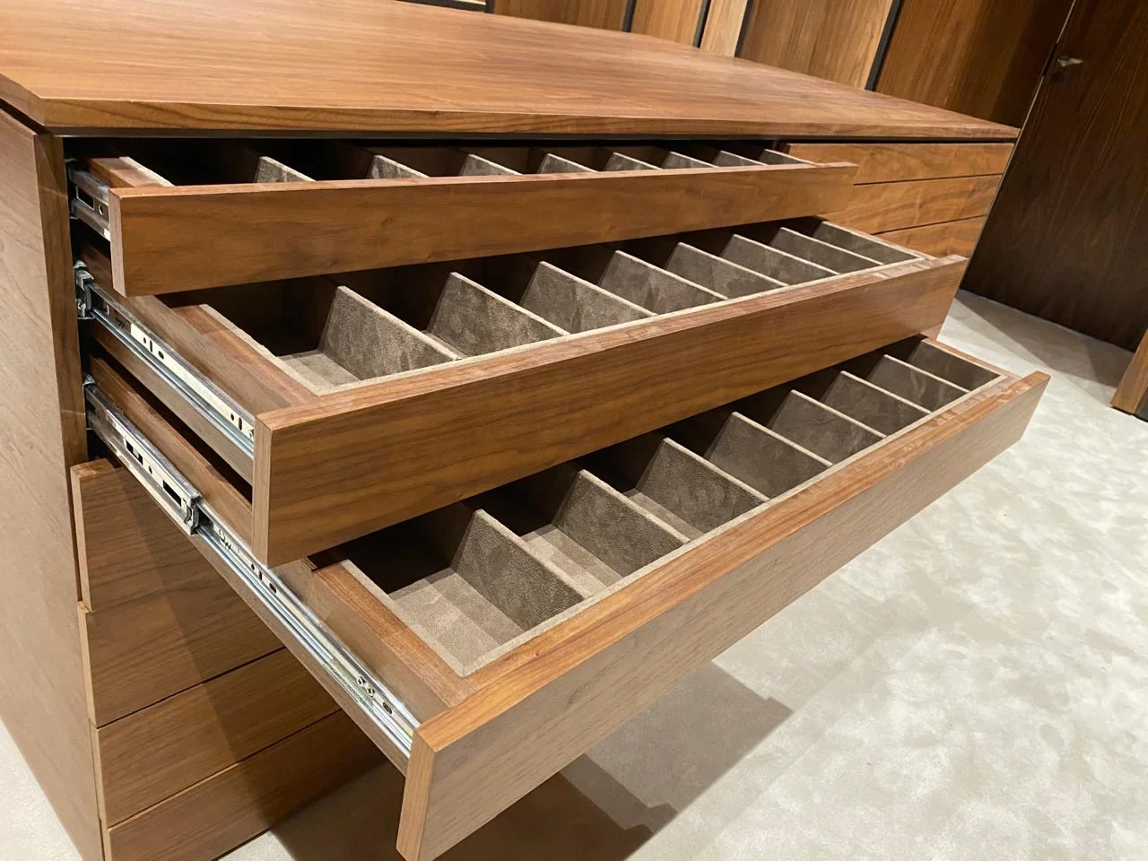 Bespoke timber wardrobe with several open pull-out storage trays